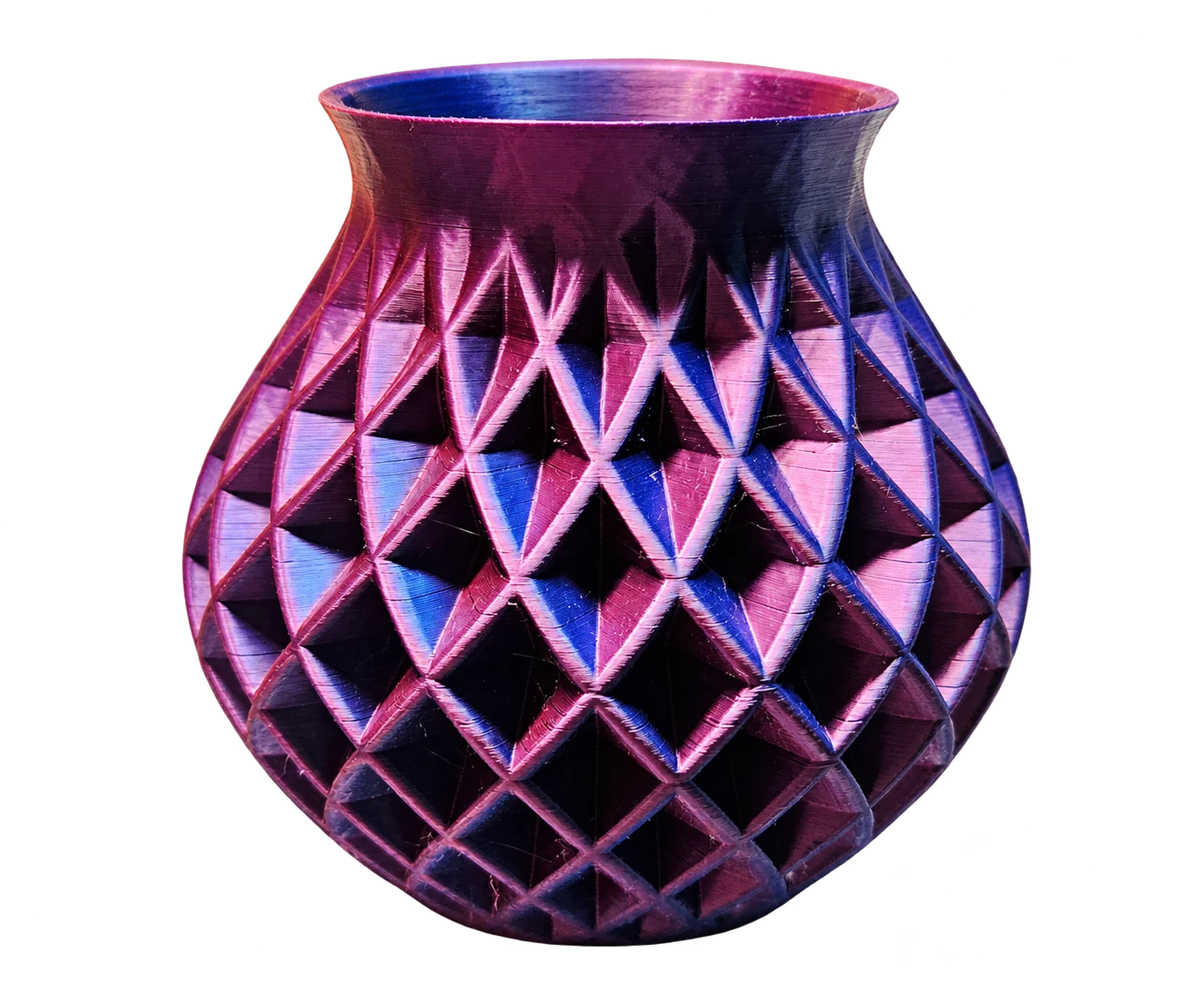 Owner’s rounded OVV3D silk vase with diamond-shaped facets reflecting pink and blue